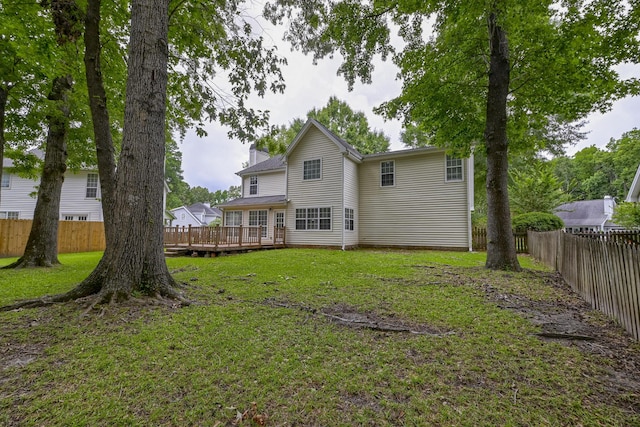 1616 Dotterers Run, Charleston, SC 29414 - rear view of house featuring a deck, a fenced backyard, and a chimney