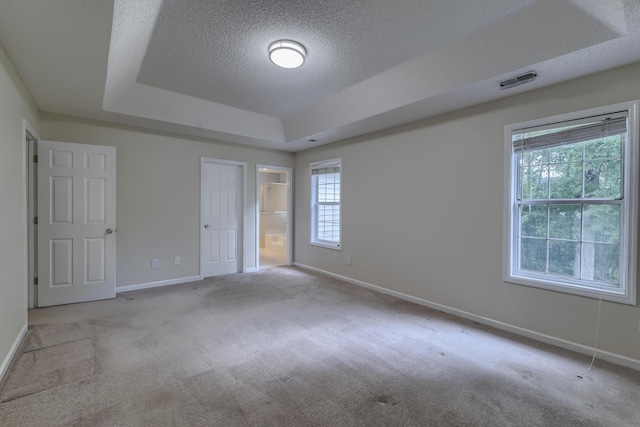 1616 Dotterers Run, Charleston, SC 29414 - unfurnished bedroom with a tray ceiling, carpet, a textured ceiling, and ensuite bath