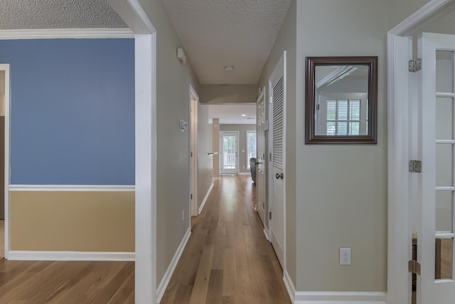 1616 Dotterers Run, Charleston, SC 29414 - hallway with a textured ceiling and wood finished floors