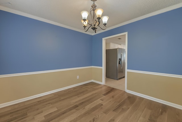 1616 Dotterers Run, Charleston, SC 29414 - spare room featuring a chandelier, wood finished floors, ornamental molding, and a textured ceiling