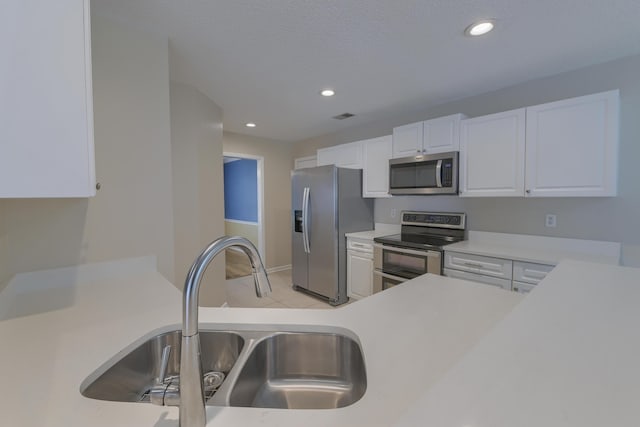 1616 Dotterers Run, Charleston, SC 29414 - kitchen with stainless steel appliances, light countertops, white cabinets, and recessed lighting