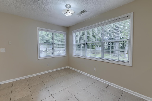 1616 Dotterers Run, Charleston, SC 29414 - empty room with a textured ceiling and light tile patterned floors