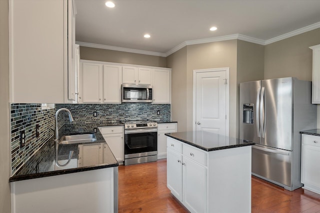 364 Deep River Rd, Summerville, SC 29486 - kitchen featuring crown molding, dark wood-style flooring, a sink, dark stone countertops, and stainless steel appliances