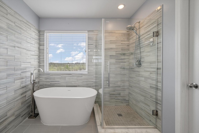 364 Deep River Rd, Summerville, SC 29486 - bathroom featuring a freestanding tub, tile walls, a shower stall, tile patterned floors, and recessed lighting