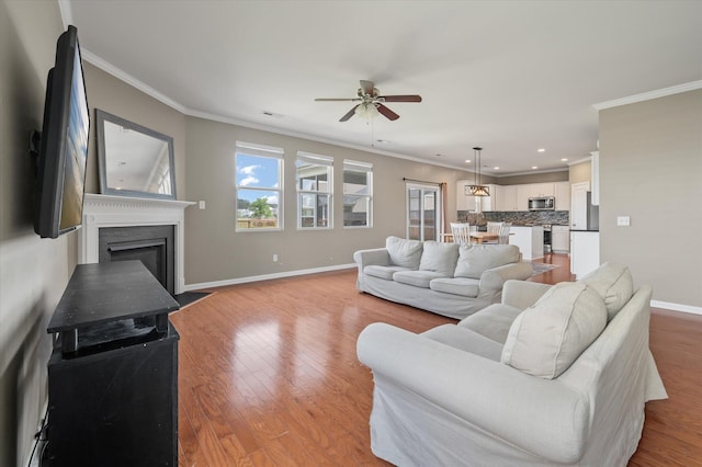 364 Deep River Rd, Summerville, SC 29486 - living room featuring ornamental molding, baseboards, light wood-style floors, ceiling fan, and recessed lighting