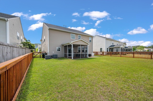 364 Deep River Rd, Summerville, SC 29486 - rear view of property with a sunroom, a fenced backyard, a lawn, and central AC