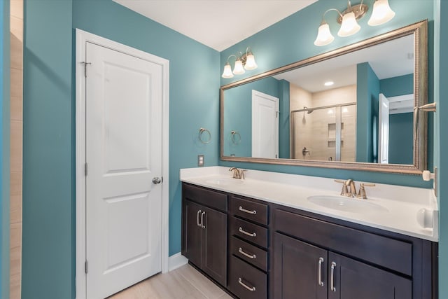 bathroom featuring vanity and an enclosed shower