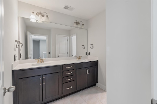 bathroom with tile patterned flooring and vanity