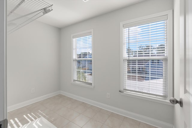 empty room with light tile patterned floors