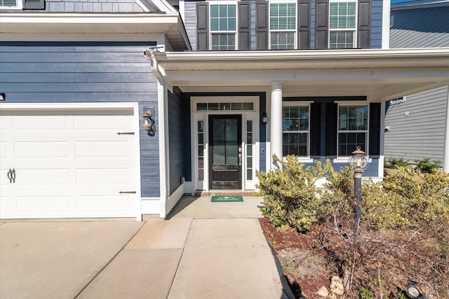 view of exterior entry with a garage