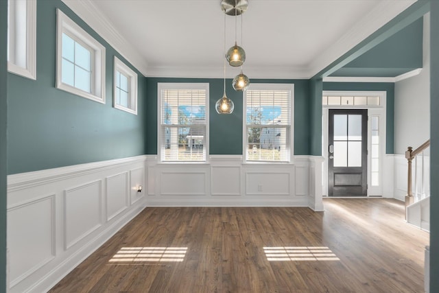 interior space featuring dark hardwood / wood-style floors and ornamental molding