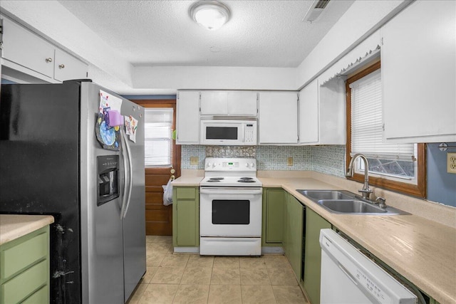 kitchen with white cabinetry, sink, green cabinets, a textured ceiling, and white appliances