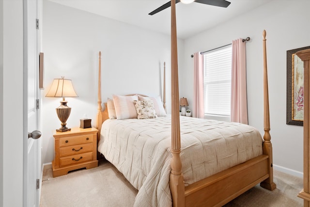 carpeted bedroom with baseboards and a ceiling fan