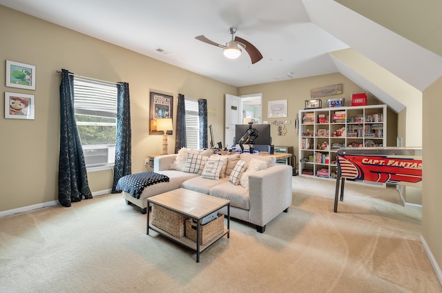 carpeted living room featuring ceiling fan