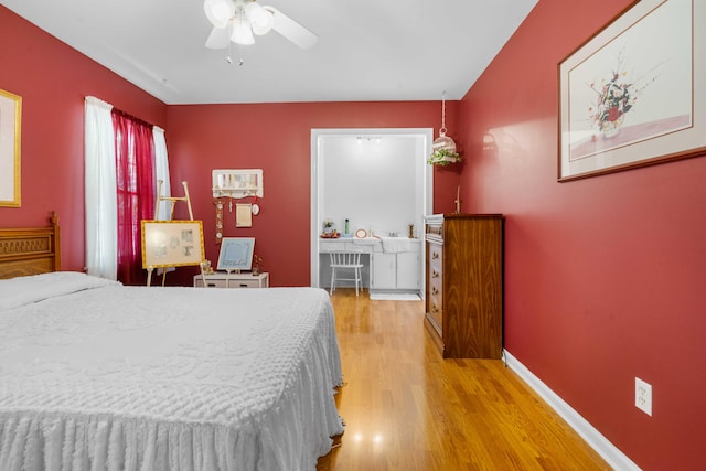 bedroom with hardwood / wood-style floors and ceiling fan