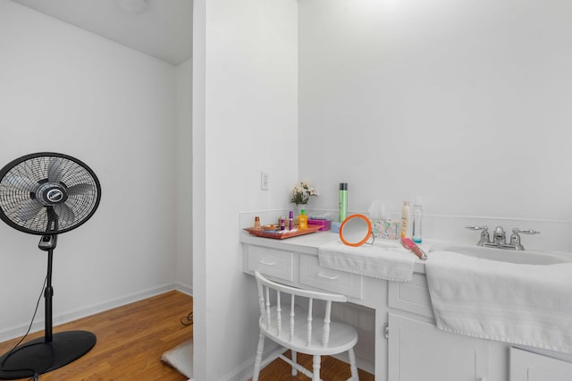 interior space with sink and light wood-type flooring