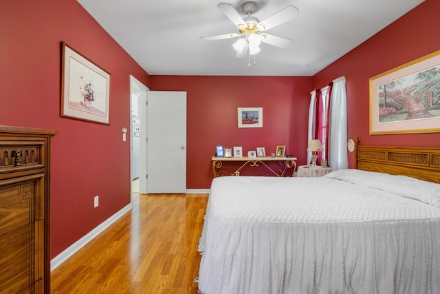 bedroom with ceiling fan and light hardwood / wood-style flooring