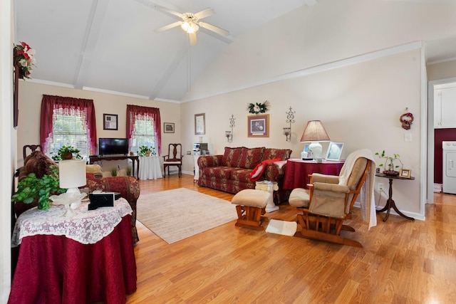 living room with washer / clothes dryer, hardwood / wood-style floors, ceiling fan, beamed ceiling, and high vaulted ceiling