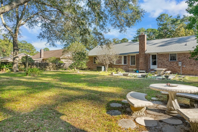 view of yard featuring a patio area and central AC unit