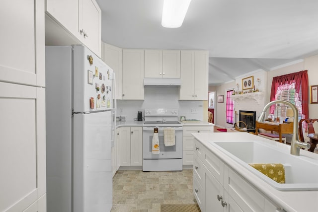 kitchen featuring white cabinets, sink, backsplash, and white appliances