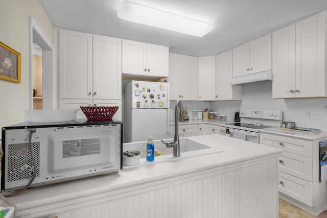 kitchen with white cabinetry, sink, and white appliances