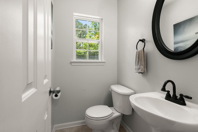 214 Blackstone Dr, Moncks Corner, SC 29461 - half bathroom featuring a sink, toilet, and baseboards