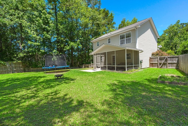214 Blackstone Dr, Moncks Corner, SC 29461 - rear view of property featuring a trampoline and a sunroom