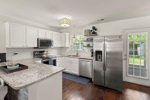 214 Blackstone Dr, Moncks Corner, SC 29461 - kitchen with appliances with stainless steel finishes, a sink, a peninsula, open shelves, and white cabinetry