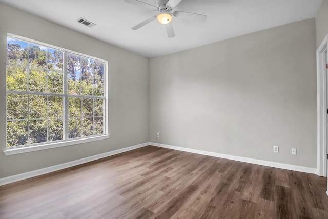 1600 Long Grove Dr Unit 423, Mount Pleasant, SC 29464 - unfurnished room featuring healthy amount of natural light, dark wood-type flooring, and ceiling fan
