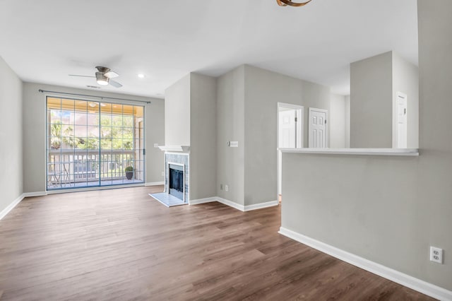 1600 Long Grove Dr Unit 423, Mount Pleasant, SC 29464 - unfurnished living room with wood finished floors, ceiling fan, a fireplace, and recessed lighting