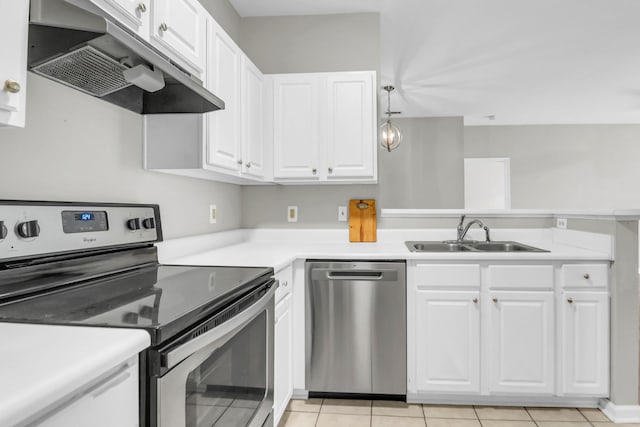 1600 Long Grove Dr Unit 423, Mount Pleasant, SC 29464 - kitchen with appliances with stainless steel finishes, exhaust hood, white cabinetry, and light countertops