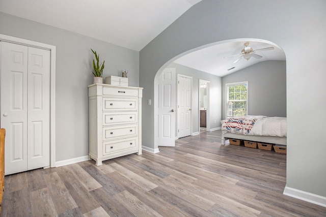 bedroom featuring lofted ceiling, hardwood / wood-style flooring, and ceiling fan