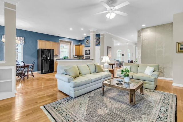 1809 Two Cedar Way, Mount Pleasant, SC 29466 - living room featuring ceiling fan, light wood-style flooring, plenty of natural light, recessed lighting, and decorative columns