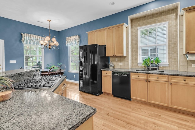 1809 Two Cedar Way, Mount Pleasant, SC 29466 - kitchen featuring black appliances, light brown cabinetry, light wood finished floors, a chandelier, and plenty of natural light