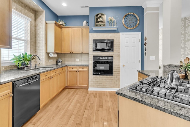 1809 Two Cedar Way, Mount Pleasant, SC 29466 - kitchen with black appliances, light brown cabinetry, light wood finished floors, tasteful backsplash, and dark stone countertops