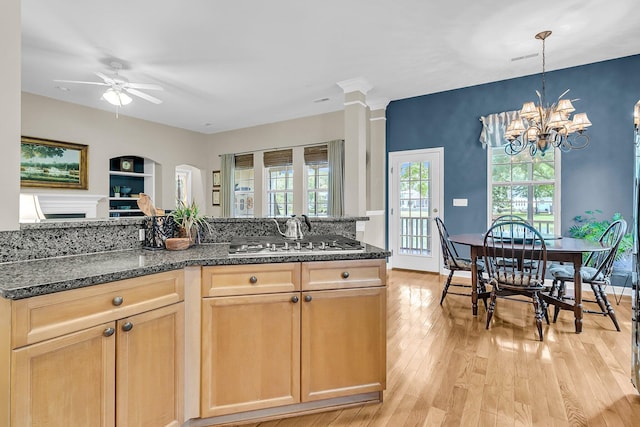 1809 Two Cedar Way, Mount Pleasant, SC 29466 - kitchen featuring light brown cabinets, a ceiling fan, light wood-style floors, dark stone counters, and a chandelier