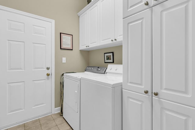 1809 Two Cedar Way, Mount Pleasant, SC 29466 - laundry room with cabinet space, washer and dryer, and light tile patterned floors