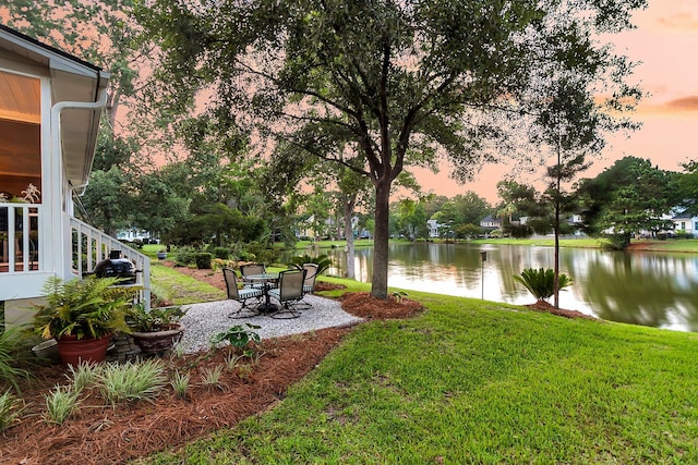 1809 Two Cedar Way, Mount Pleasant, SC 29466 - yard at dusk with a yard, a water view, and a patio area