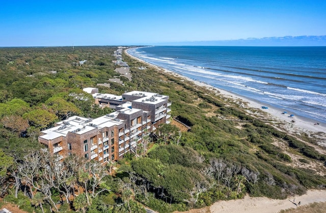 birds eye view of property featuring a view of the beach and a water view