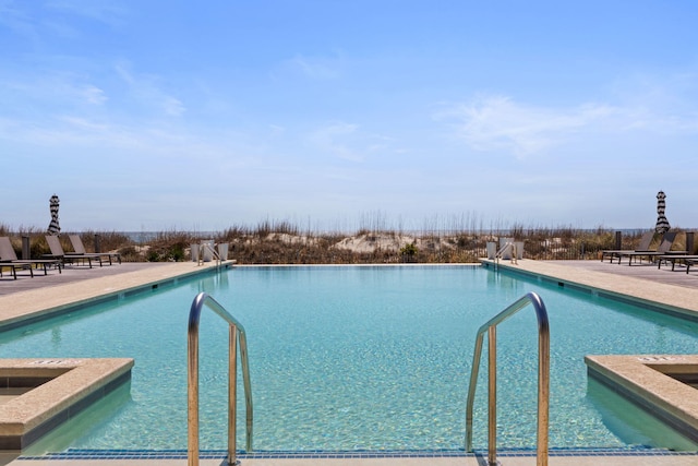 view of pool featuring a patio