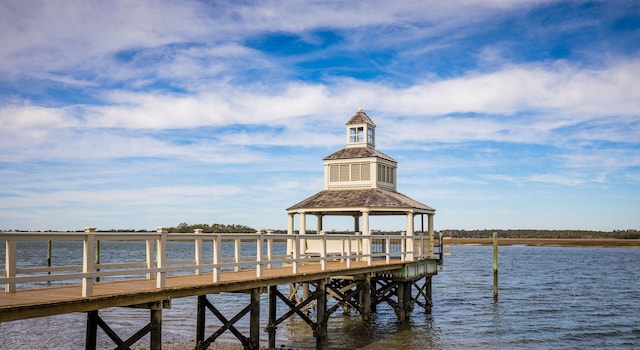 view of dock with a water view and a gazebo