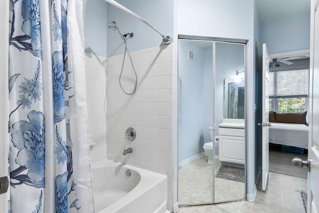 bathroom with shower / bath combo, vanity, toilet, tile patterned floors, and a ceiling fan