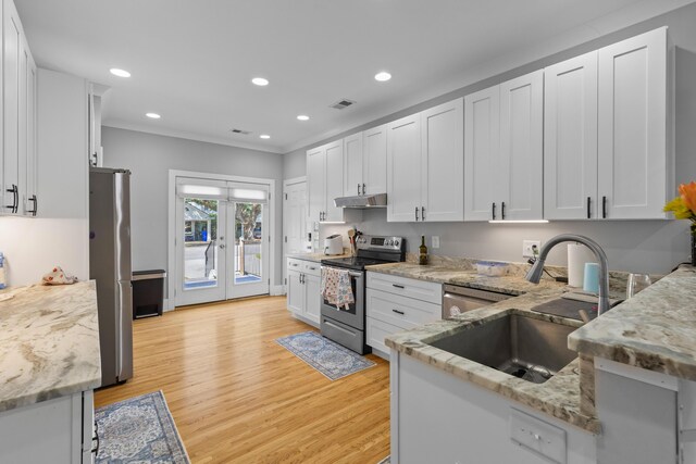 7 Wesley Dr, Charleston, SC 29407 - kitchen featuring stainless steel appliances, under cabinet range hood, a sink, light stone countertops, and recessed lighting