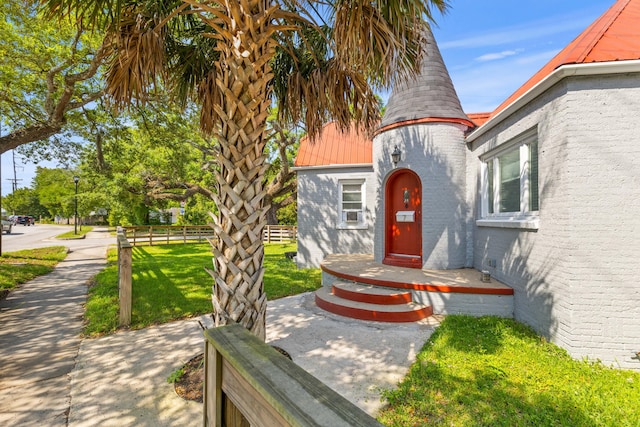 7 Wesley Dr, Charleston, SC 29407 - property entrance with brick siding and metal roof