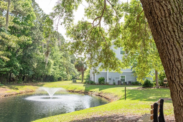 exterior space with a yard and a water view