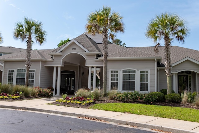 view of front of home with roof with shingles