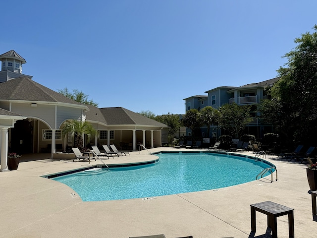 community pool featuring a patio area