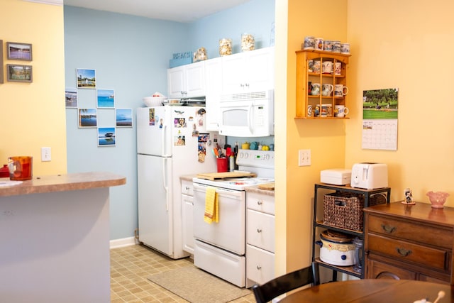 kitchen with light countertops, baseboards, light floors, white appliances, and white cabinetry