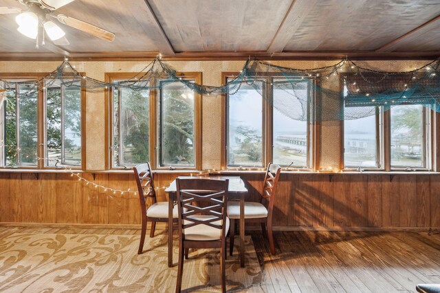 sunroom / solarium with ceiling fan and wooden ceiling