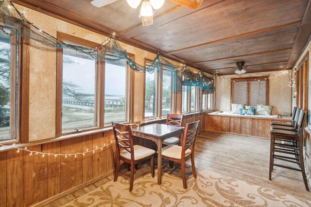 sunroom featuring wooden ceiling and ceiling fan